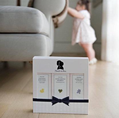 Product packaging with silhouette design on a blurred background of a living room.