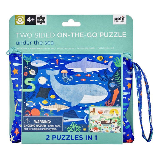 Two-sided on-the-go puzzle packaging with whale illustration and lanyard