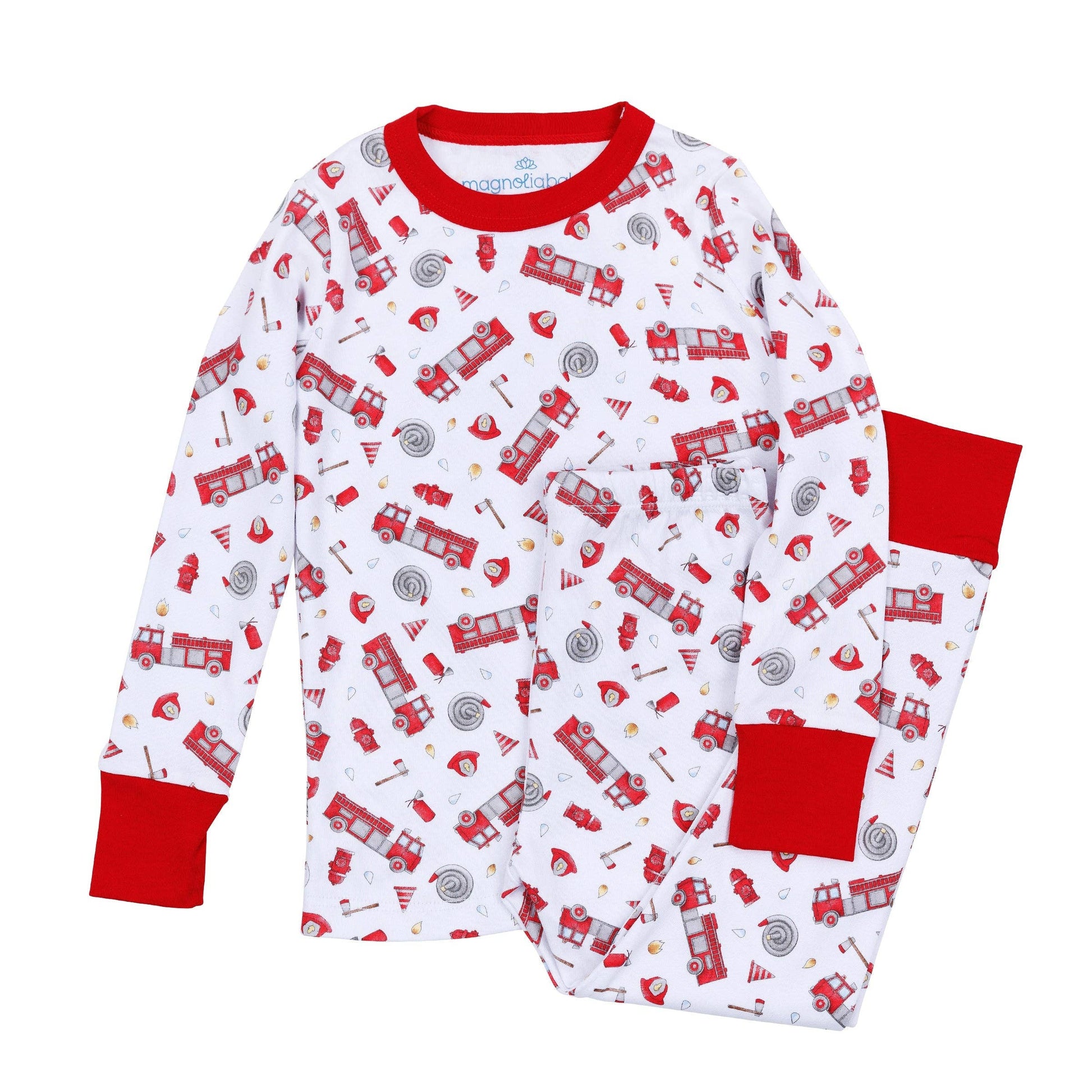 Children's pajama set with fire truck pattern on a white background