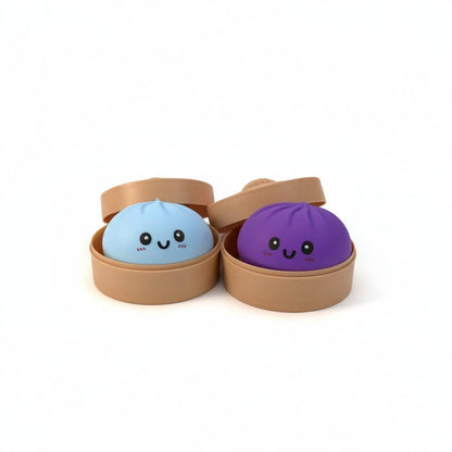Two cute, round characters in brown containers on a white background