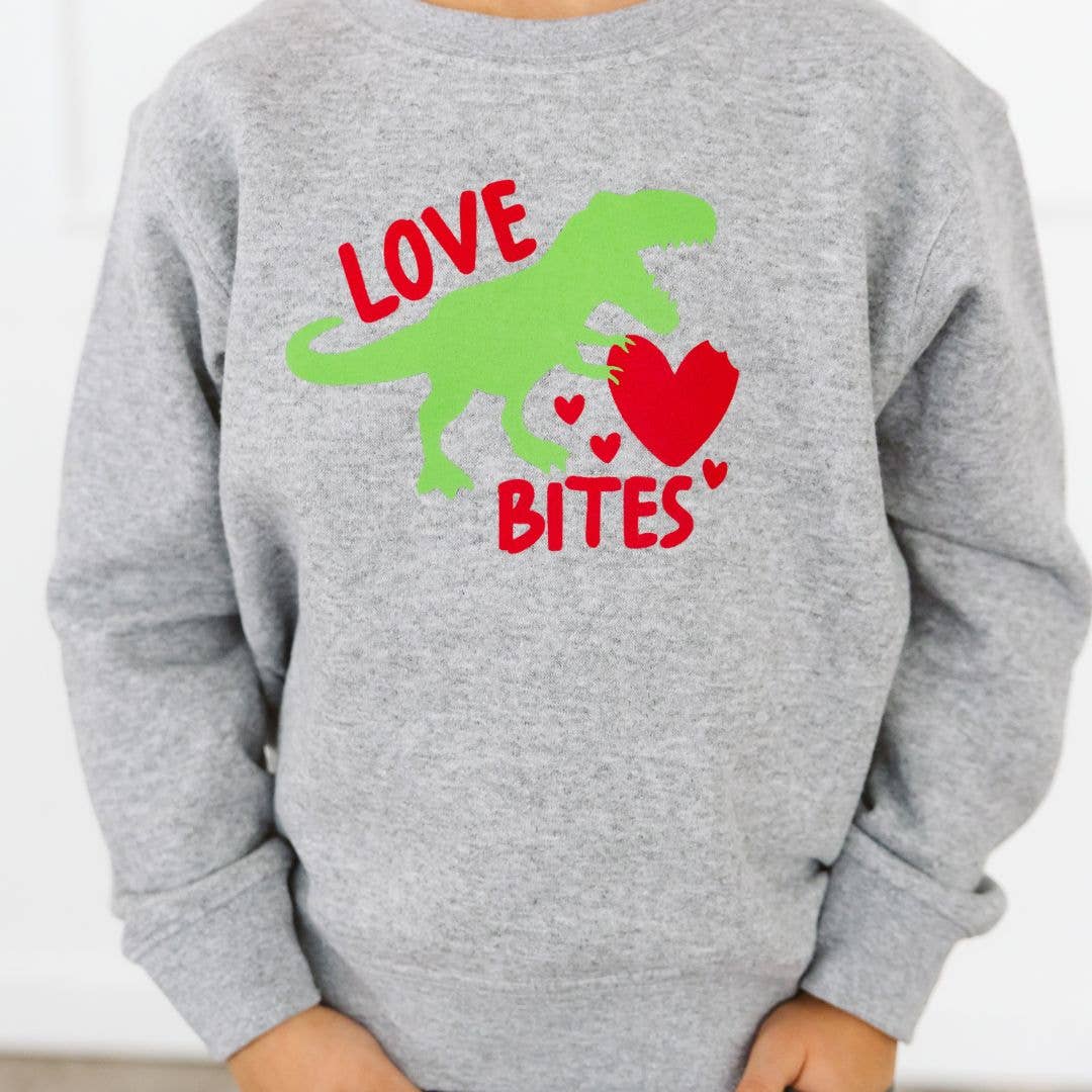 Gray sweatshirt with a green dinosaur, red hearts, and text on a white background
