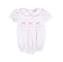 Baby romper with pink floral design on a white background