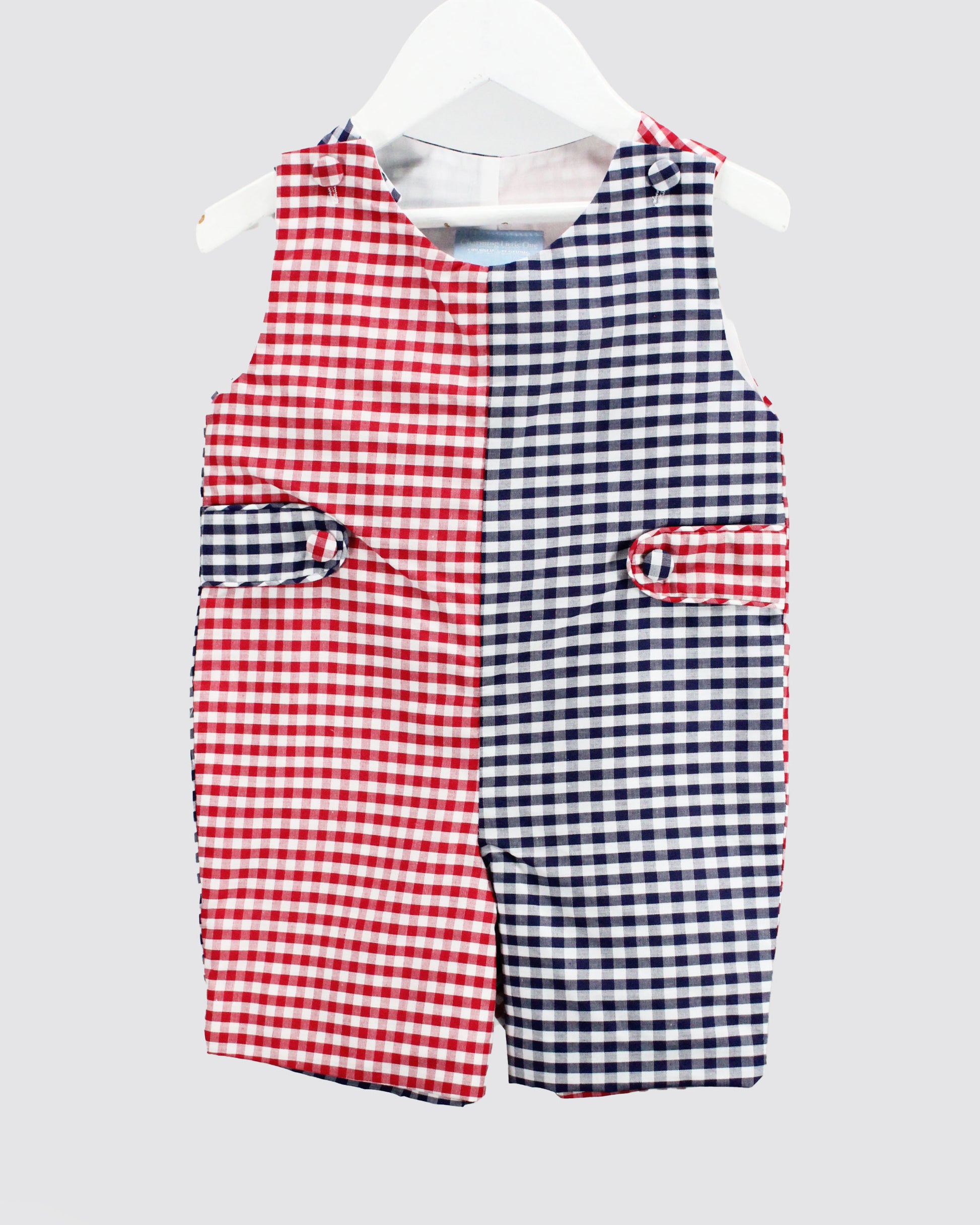 Red and blue checkered baby romper on a white background