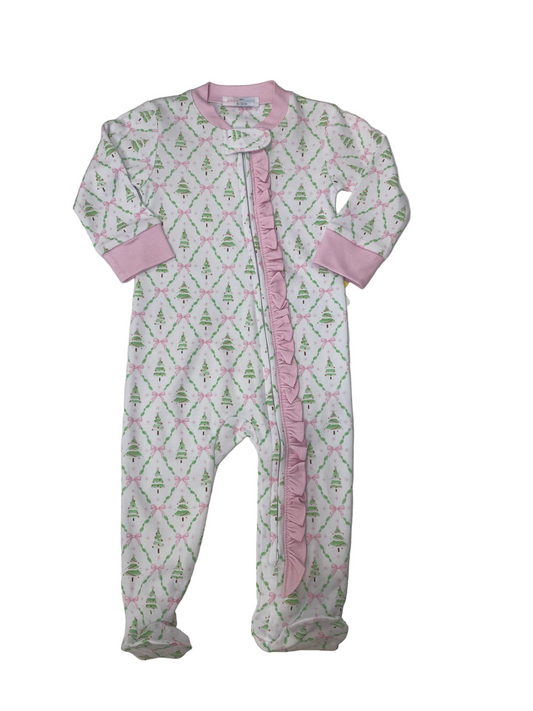 Baby onesie with pink and green pattern on a white surface