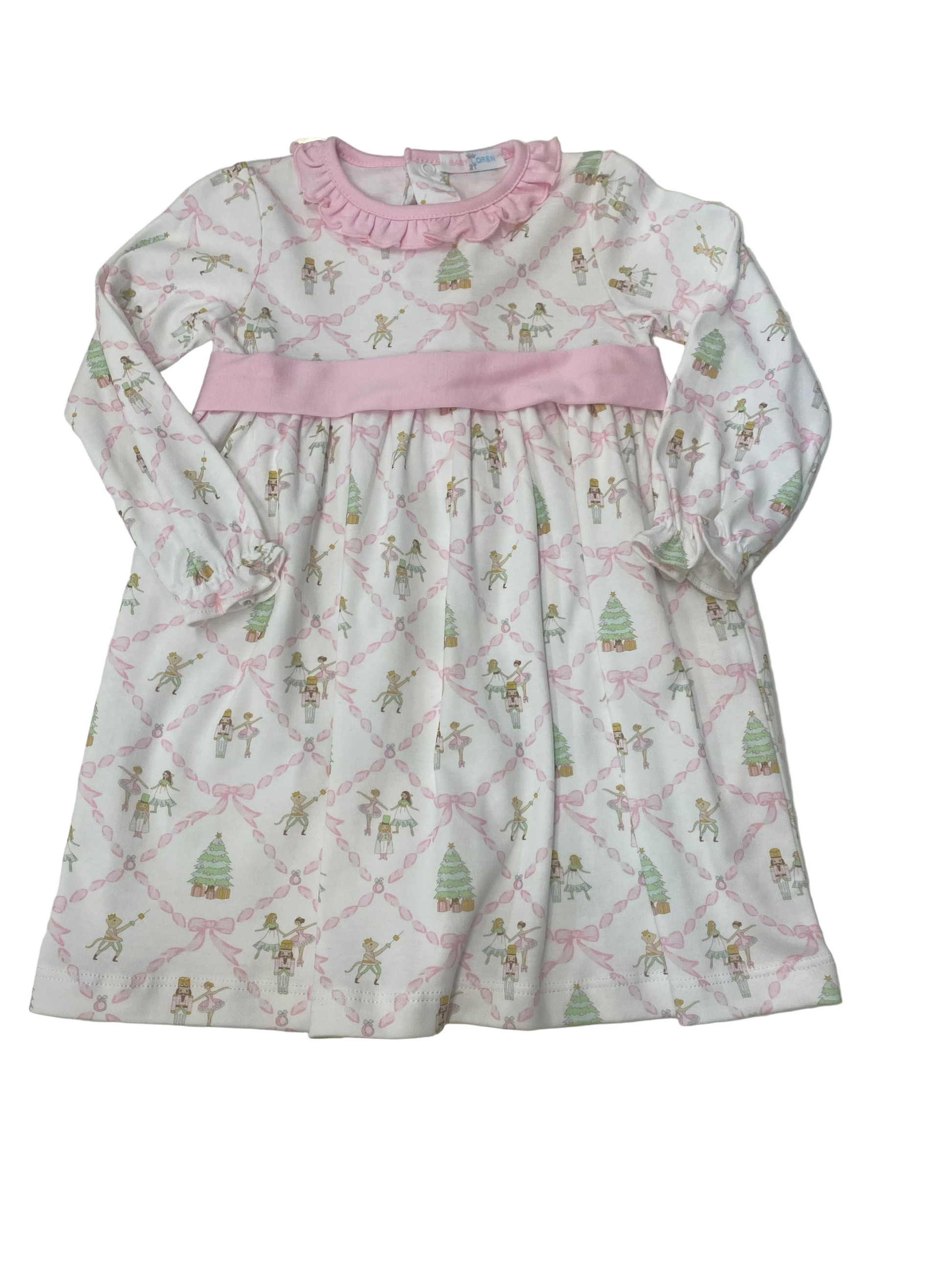 Children's dress with a pattern of cartoon characters on a white surface