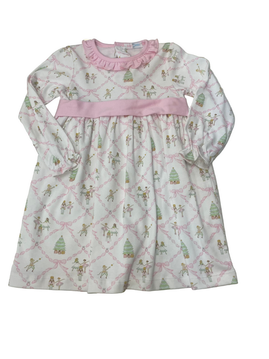 Children's dress with a pattern of cartoon characters on a white surface