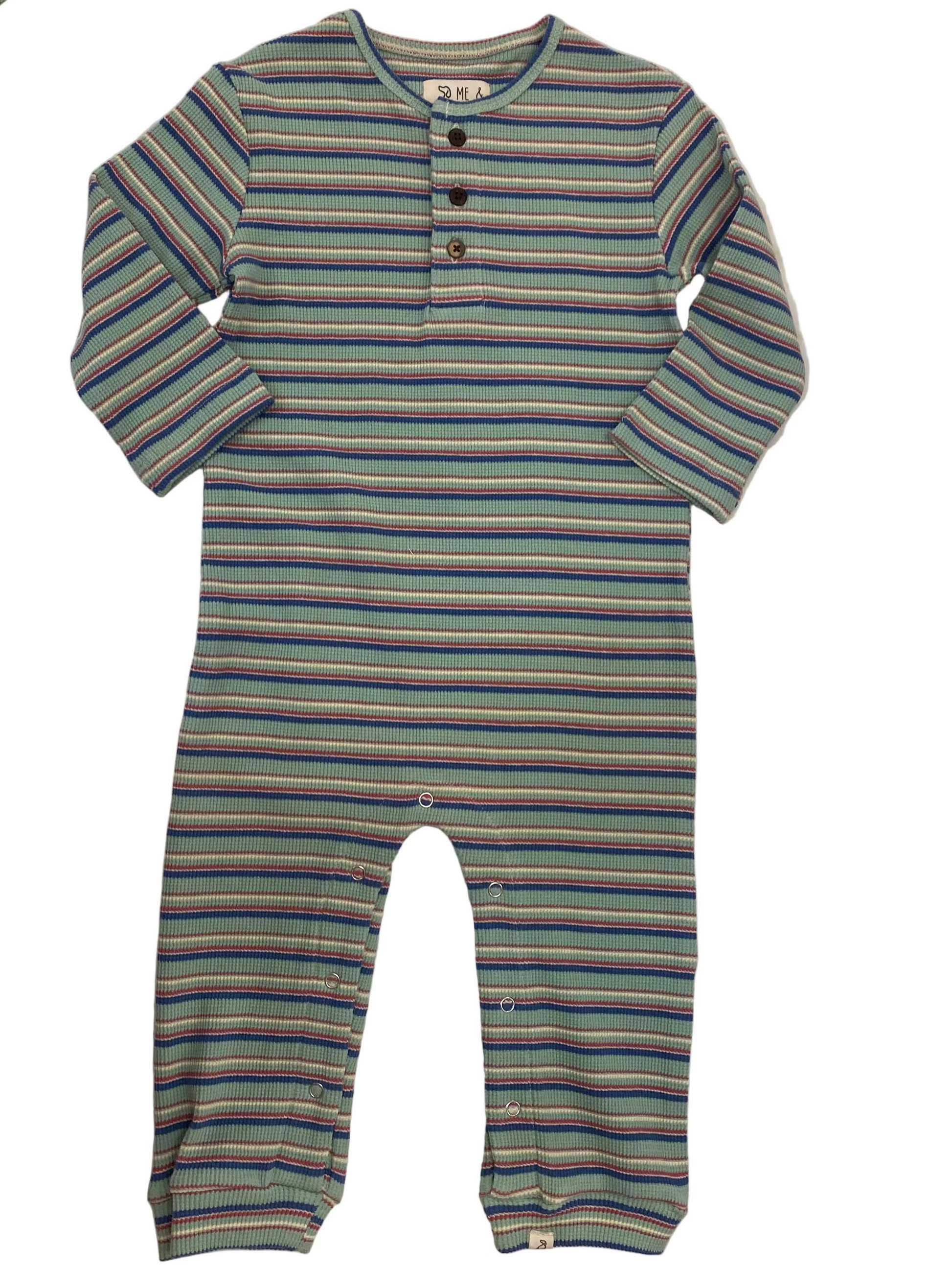 Striped baby romper on a marble surface