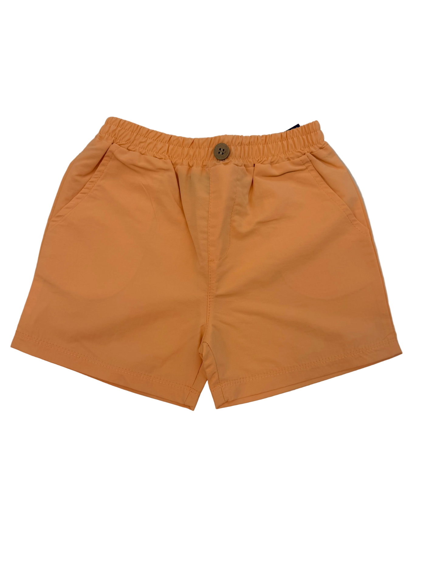 Orange shorts on a light marble floor
