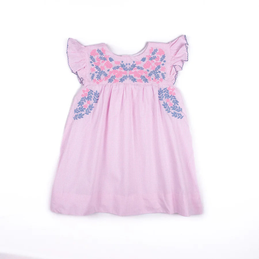 Pink dress with floral embroidery on a white background