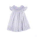 White dress with blue floral pattern on a white background