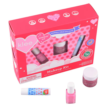 Klee makeup kit with pink packaging and various small bottles on a white background