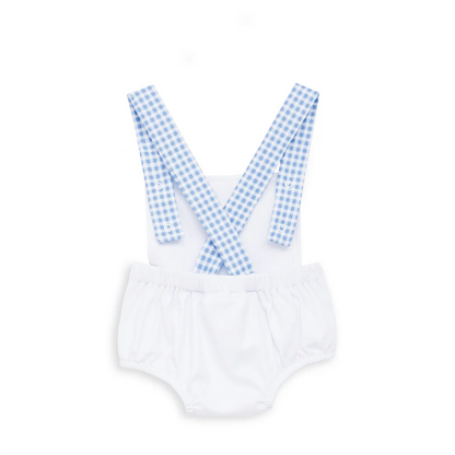 White baby romper with blue gingham straps on a white background