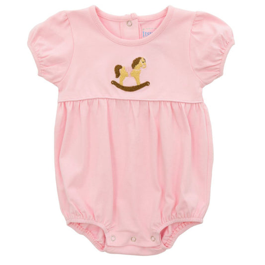Pink baby romper with a rocking horse design on a white background