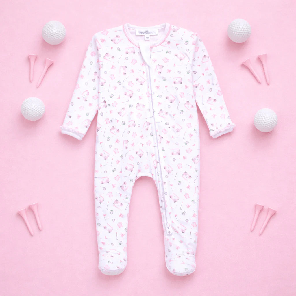 White baby onesie with pink floral pattern on a pink background