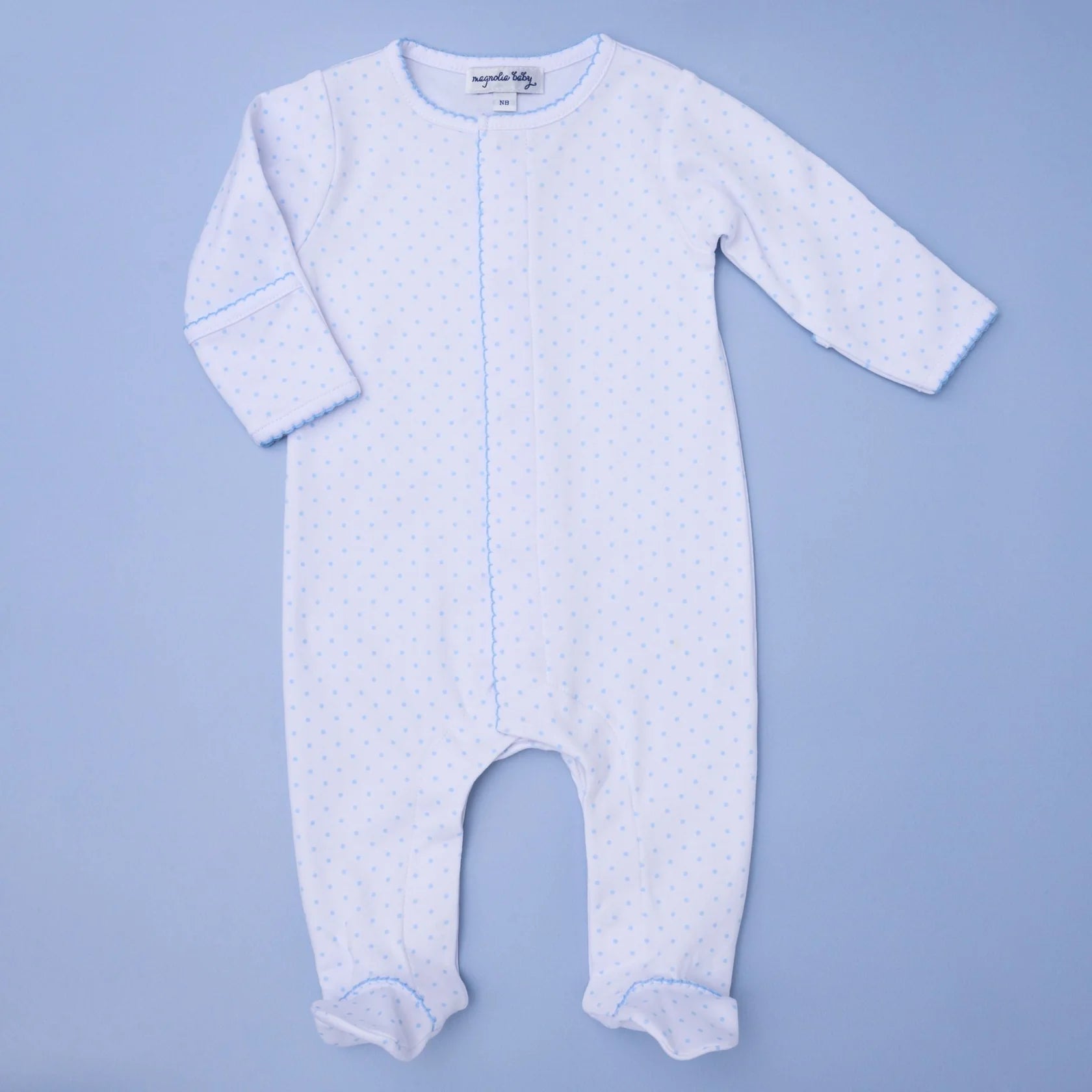 Baby onesie with long sleeves and legs on a light blue background
