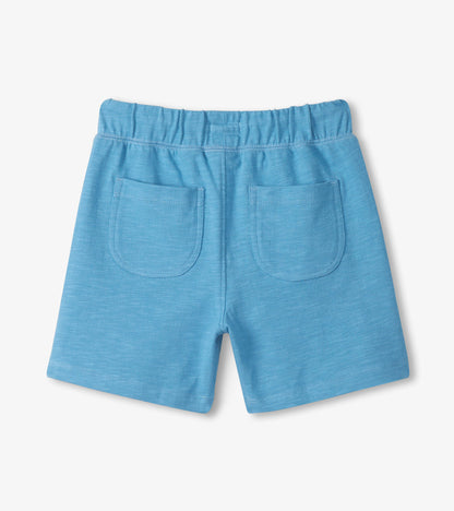 Blue shorts with two pockets on a light gray background