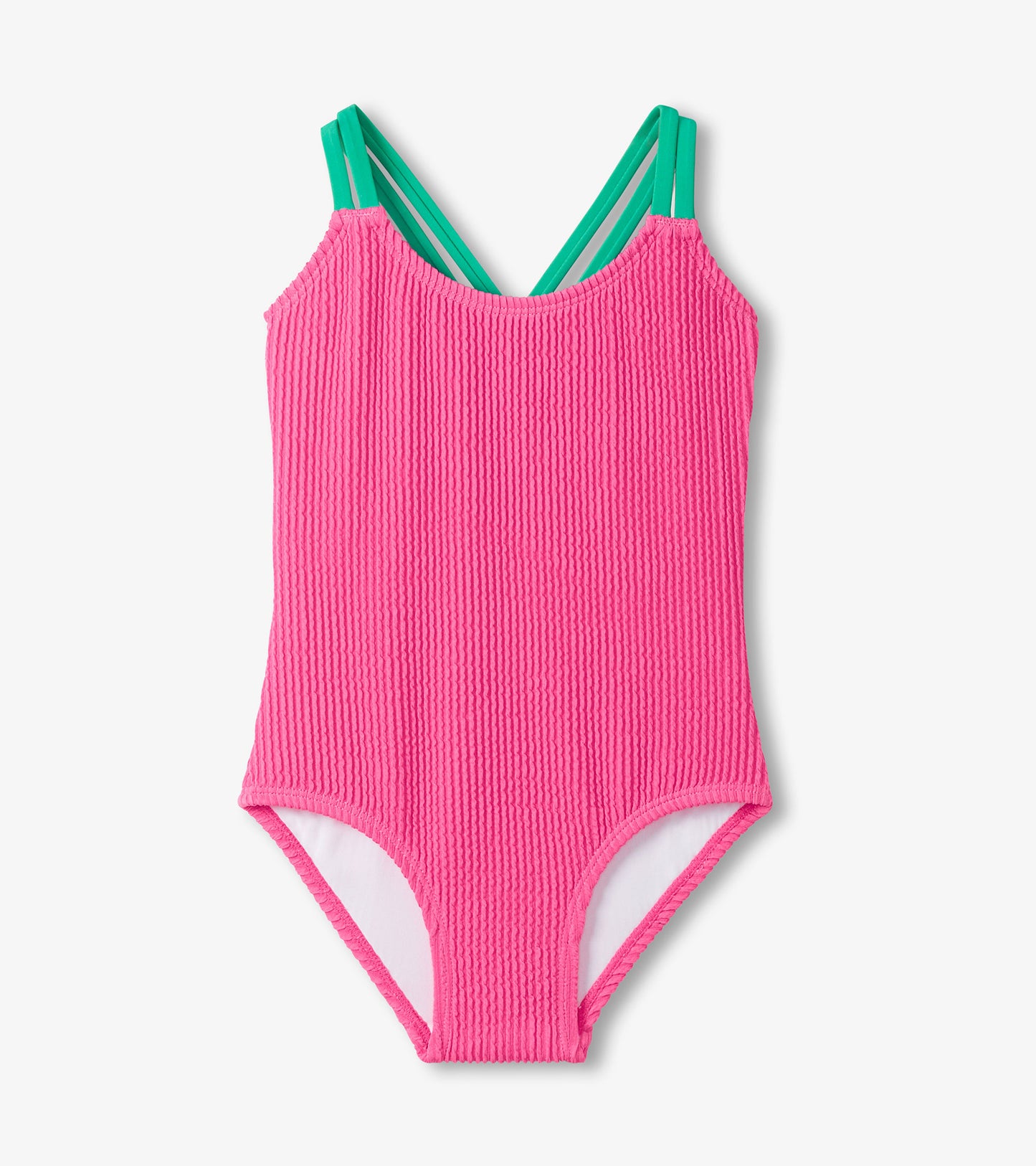Pink ribbed swimsuit with green straps on a white background