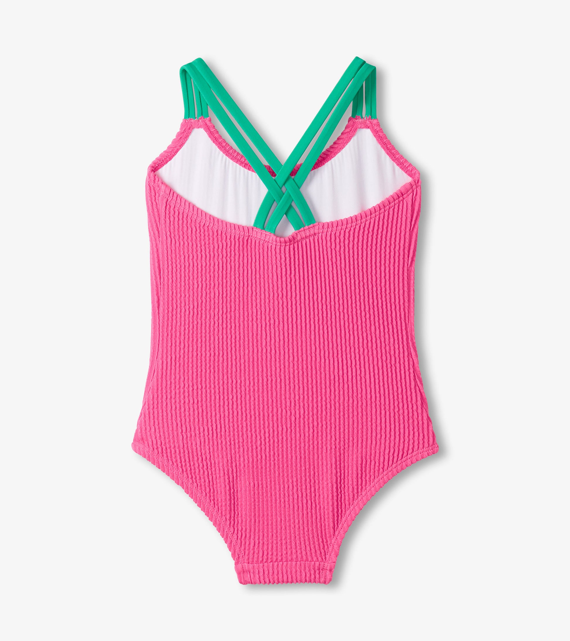 Pink ribbed swimsuit with green straps on a white background