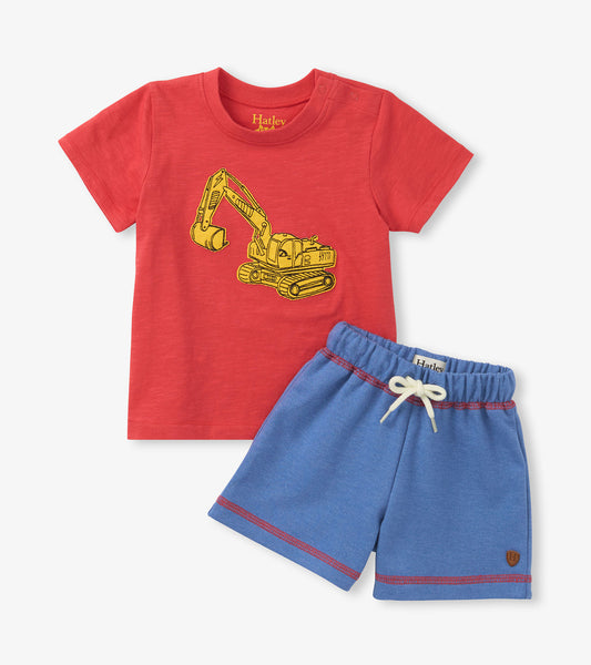 Red t-shirt with yellow excavator graphic and blue shorts on a white background