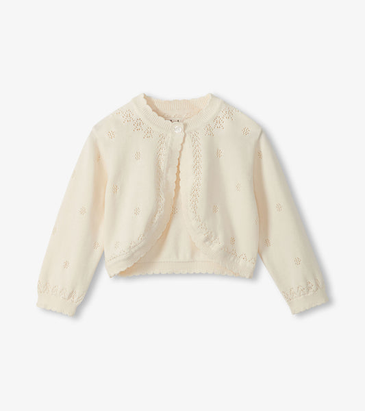 Cream-colored cardigan on a white background