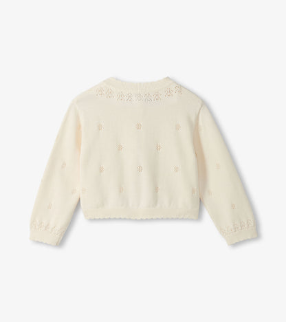 Cream-colored cardigan with lace detailing on a white background