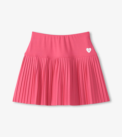 Pink pleated skirt with a heart logo on a light gray background