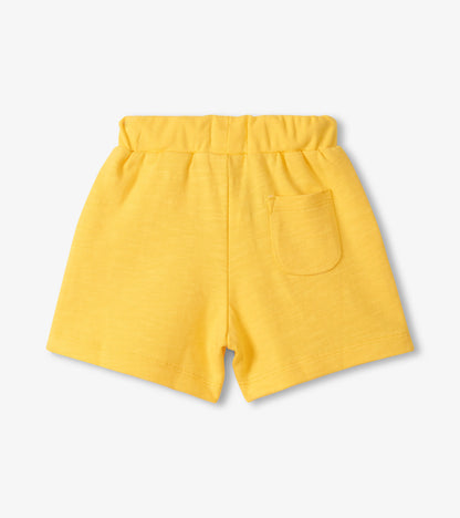 Yellow shorts on a light gray background