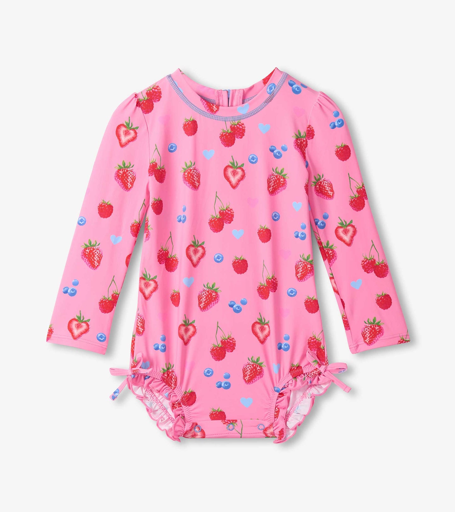 Pink children's swimsuit with strawberry pattern on a white background