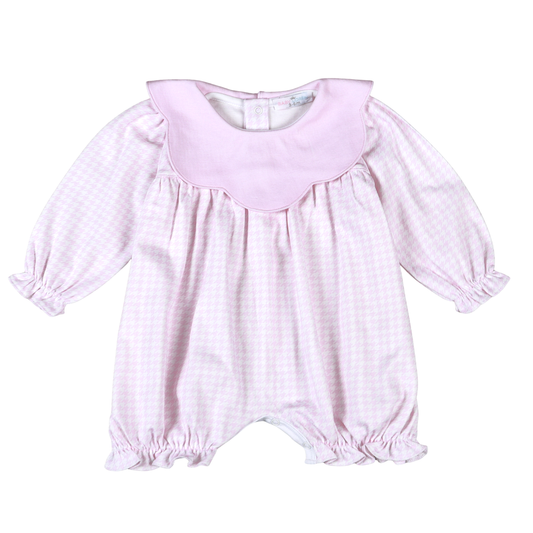 Pink baby romper with long sleeves on a white background